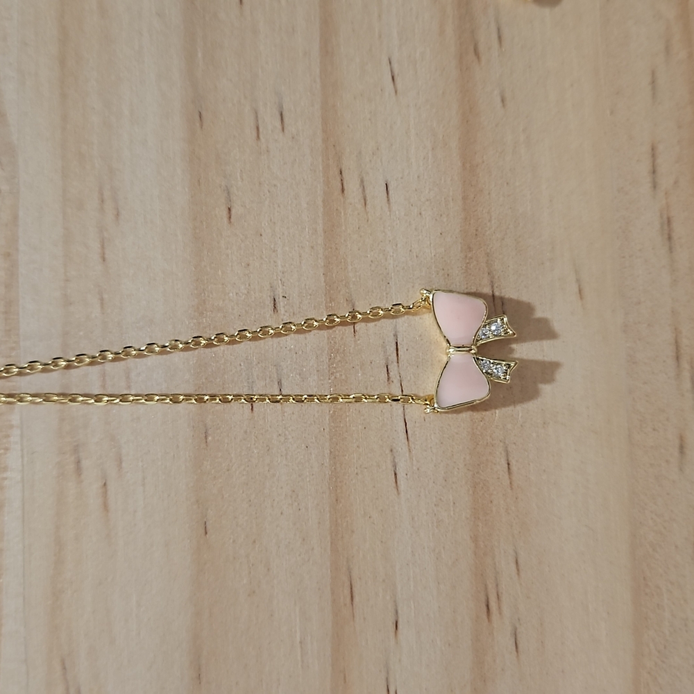 Elegant Pink and Gold Bow Necklace